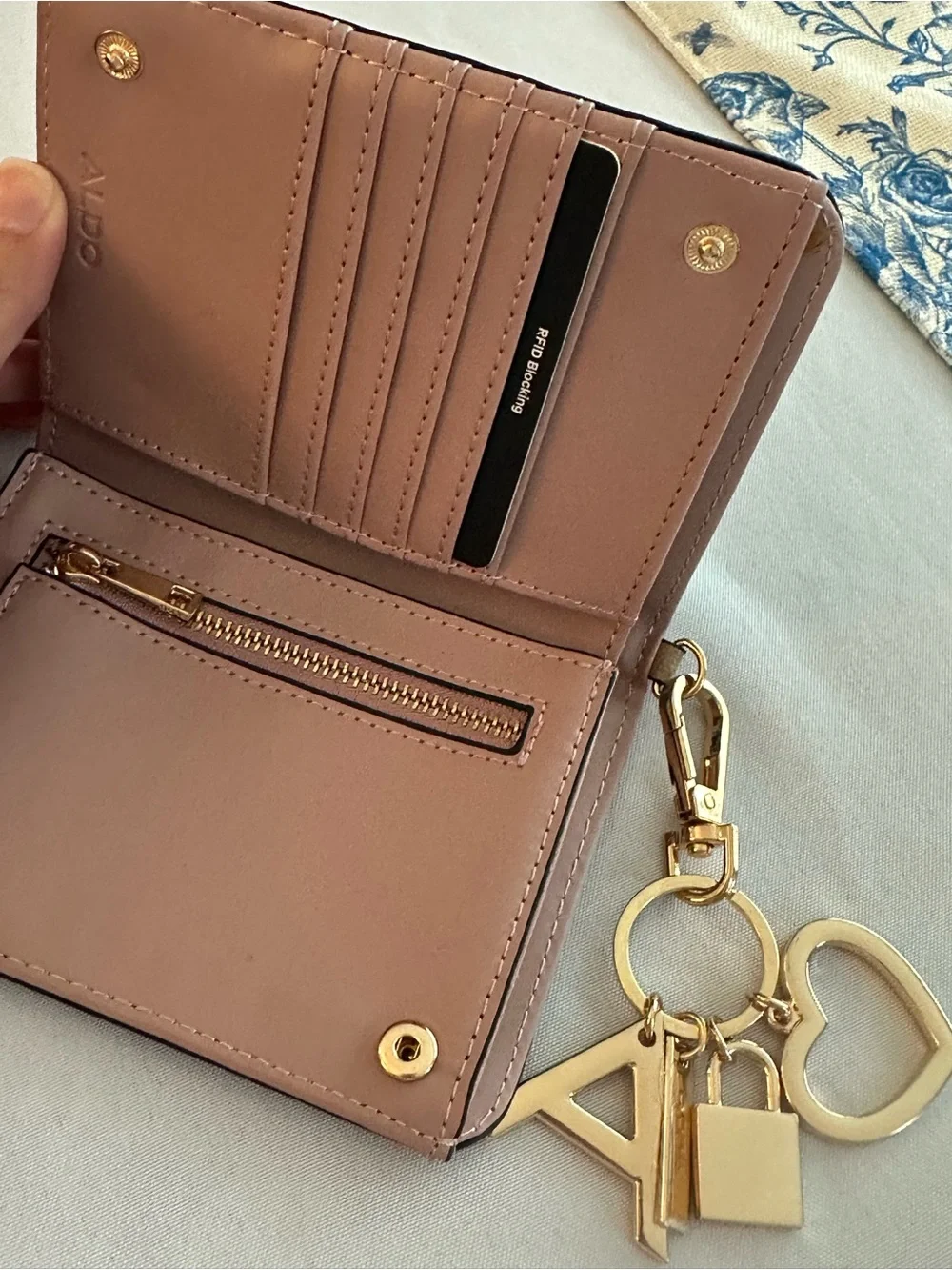 ALDO taupe card & charm key holder with gold accents